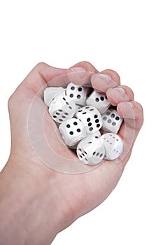 Hand full of white dices isolated on white