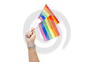 Hand with gay pride rainbow flags and wristband