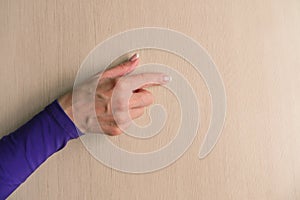 Hand gesture of middle aged woman. Mockup on desk background. Template closeup with copy space. Finger touching or scrolling.