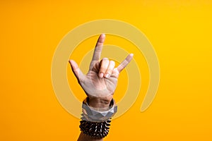 Hand gestures. Thumbs up, that& x27;s a cool gesture of the rocker. photo
