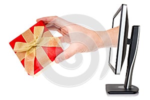 Hand with gift box comes out of monitor