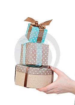 Hand with gift boxes in woman hand for christmas or birthday present
