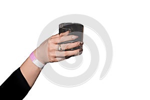 The hand of girl glass of alcoholic beverage on a white background, isolated, holiday weekend