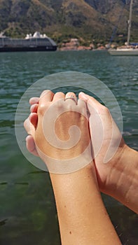 Hand of a girl in the hand of a guy, Adriatic Sea, Montenegro