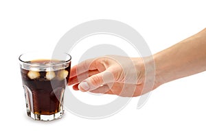 Hand of girl holding glass of rum with coke.