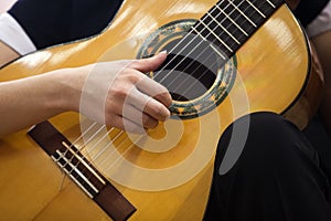 Hand girl playing guitar