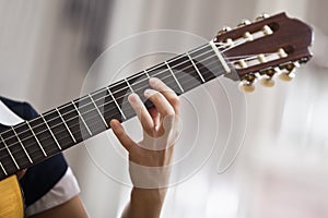 Hand girl playing guitar