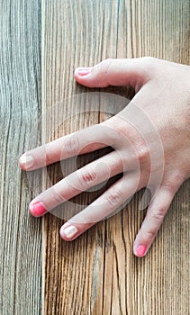 Hand of a girl with varnished nails