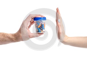 Hand give jar pills to hand renouncement