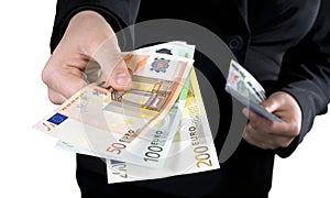 Hand giving Euro banknotes money