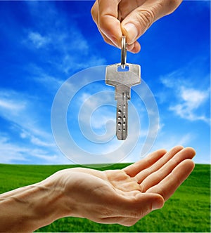 Hand giving key