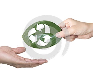 Hand giving leaf with hole of recycling symbol, resource recovery