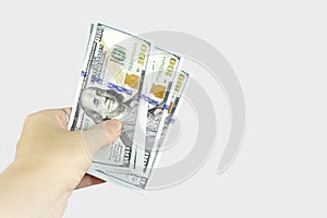 Hand giving money on white background, concept of investment, success and profitable