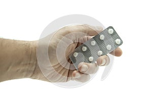 Hand giving a tablet of white pills on white background