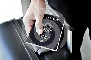 Hand giving U.S. passport