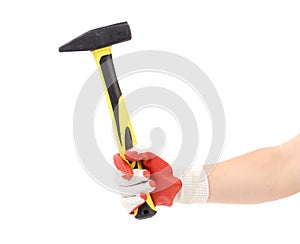 Hand in glove holding metal hammer.