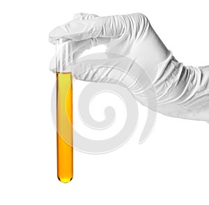 Hand in glove holding test tube with color sample on white background