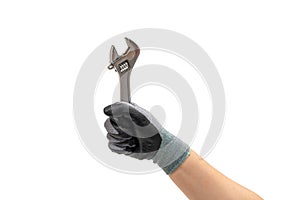 Hand of a gloved man holding a wrench. Isolated white background