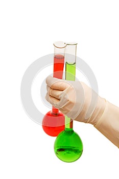 Hand in gloves holding tubes