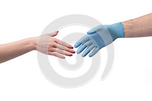 Hand in gloves shaking hand without gloves