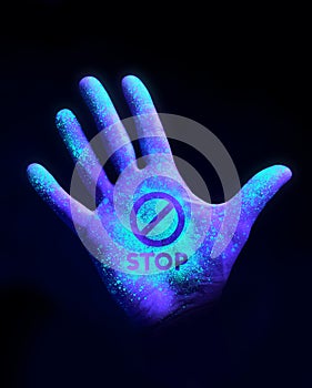 Hand Glowing With Ultra Violet Light Showing Bacteria