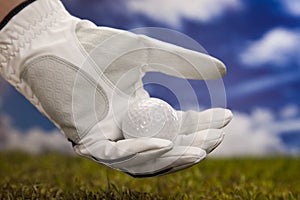 Hand and golf ball