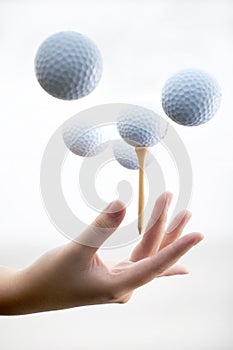 Hand with golf-ball