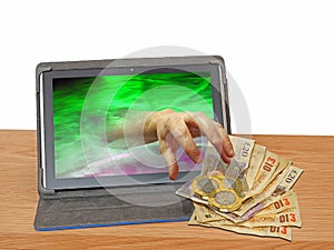 Hand grab cash money computer hack hacking malware trojan ransomware scam hijack
