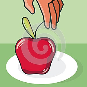 Hand grabbing apple