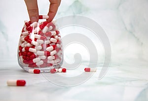 A hand grabbing hand full of medicines, Capsules for Vitamines,drugs,medication. Health,business concept