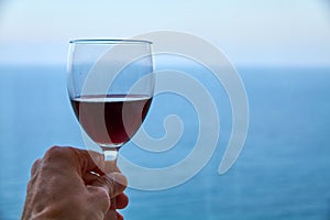Hand grabing a glass of wine