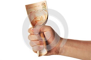 Hand grasping a stack of singapore dollars photo