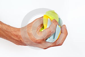 Hand grasps the paper trash on white background