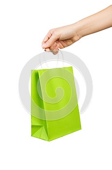 Hand with green bag isolated on white background