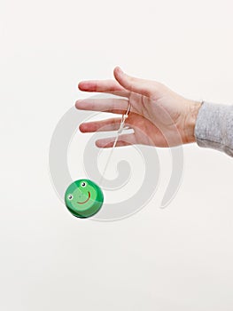Hand with a green yo-yo