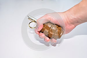 The hand grenade on a white background close-up