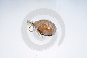 The hand grenade on a white background close-up