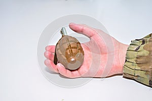 The hand grenade on a white background close-up