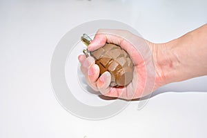The hand grenade on a white background close-up