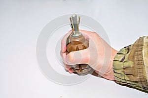 The hand grenade on a white background close-up