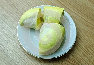 Hand Gripping Ripe Durian Fruit Pulp Close-up