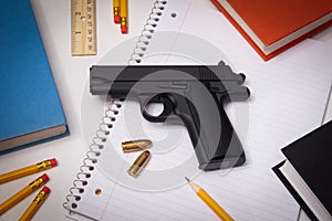 Hand Gun and School Supplies