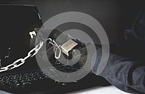 Hand of hacker unlock computer. Dangerous hacker stealing data