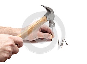 Hand with hammer nailing