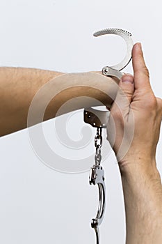 A hand that is handcuffed another