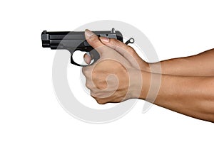 A hand with handgun wrong thumb gripping style