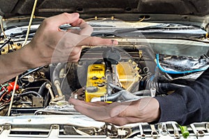 Hand handing over car keys with finger and hand receiving on eng