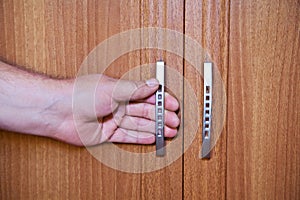 Hand on the handle of closet