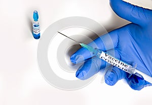 Hand handling the coronavirus vaccine or covid-19, medical and sanitary equipment