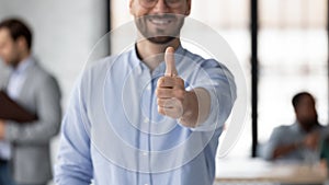 Hand of happy business leader satisfied with his team success